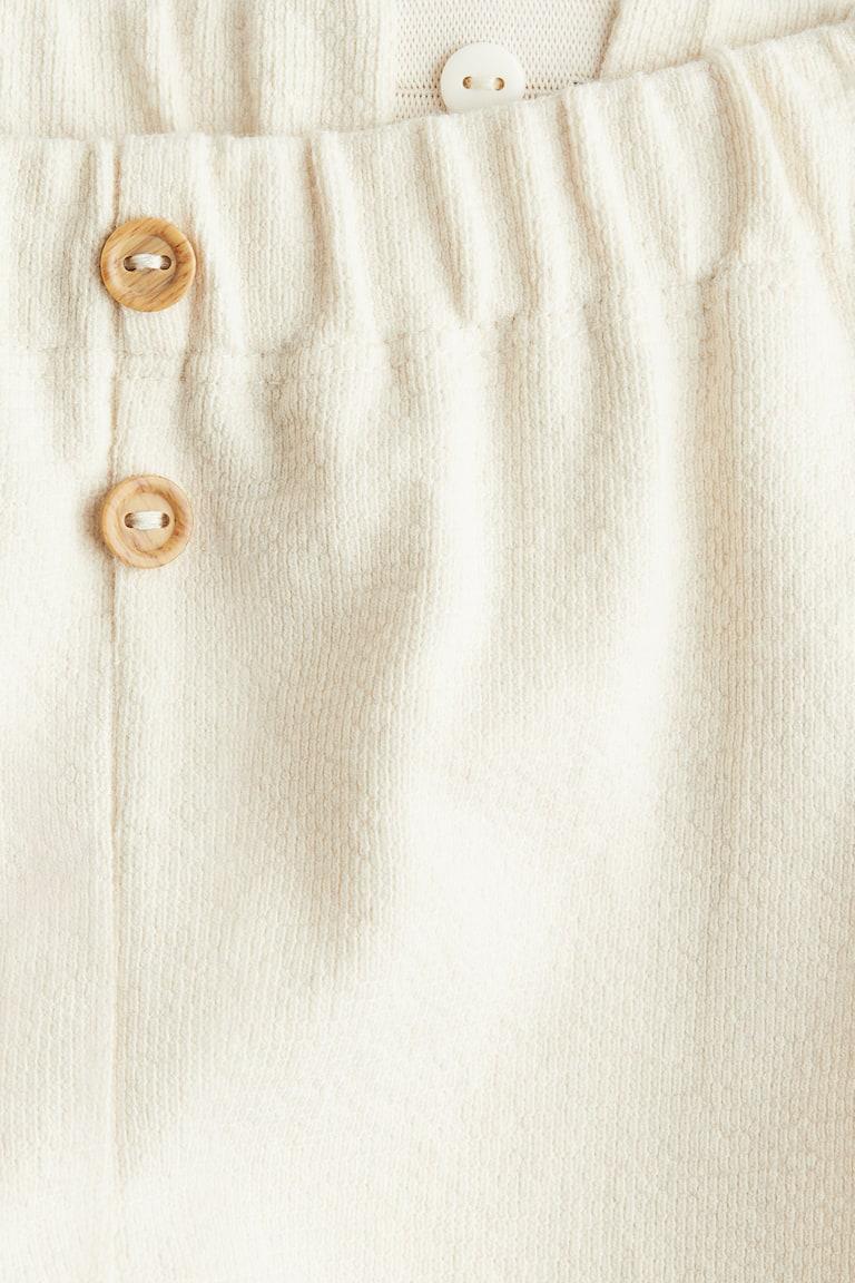 H&M Hose mit Zierknöpfen Vierteljährliche Förderung