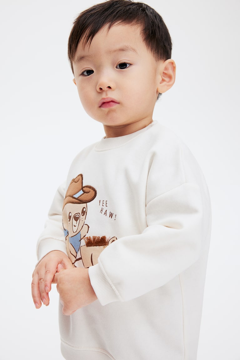 H&M Sweatshirt mit Motiv im Angebot