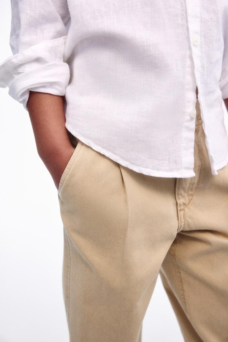 H&M Loose-fit tapered twill chinos Kauf eins, bekomm eins gratis